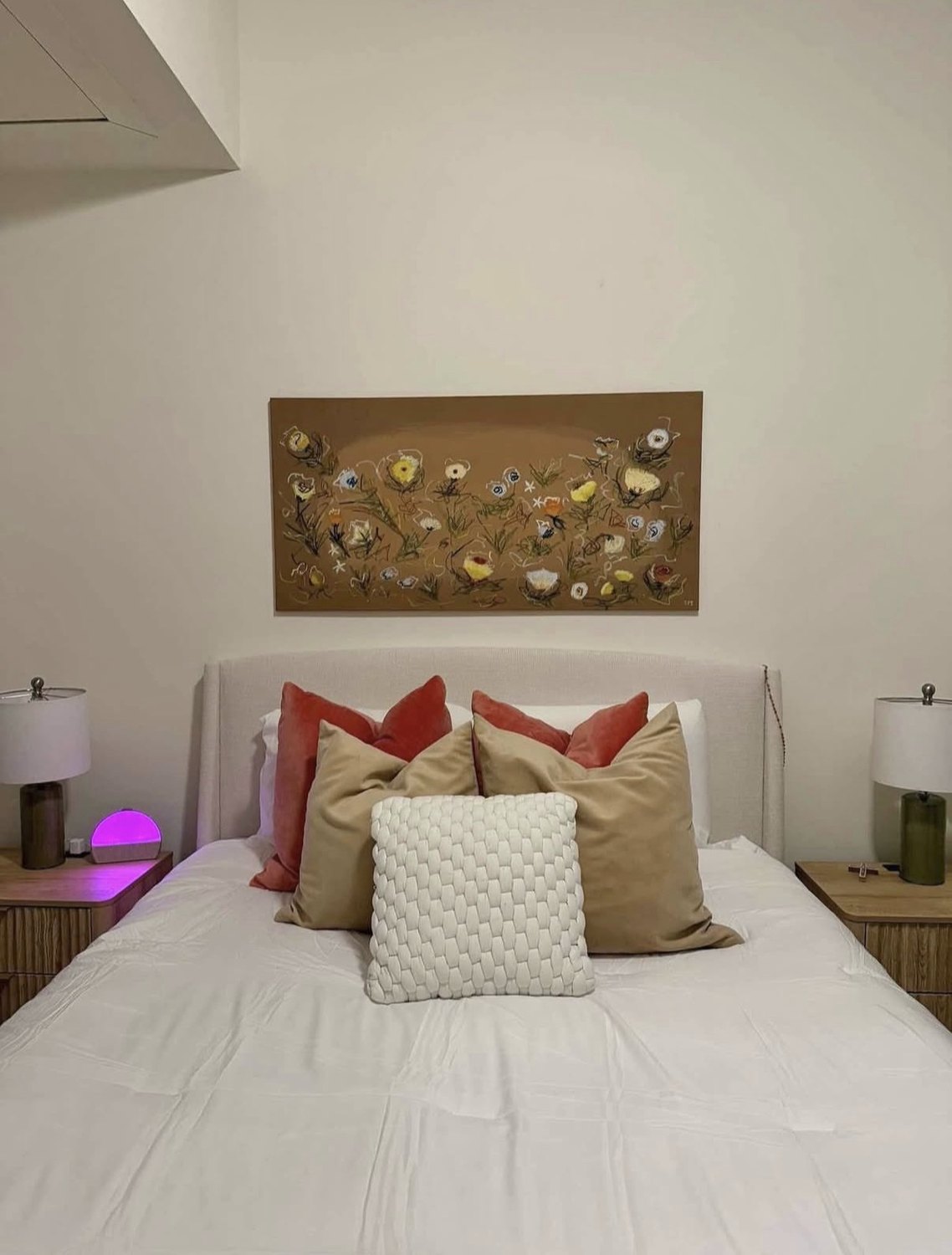 Earthen Bloom hung above a bed in a client's bedroom
